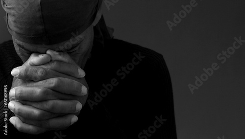 black man praying to god on gray background with people stock image stock photo © herlanzer