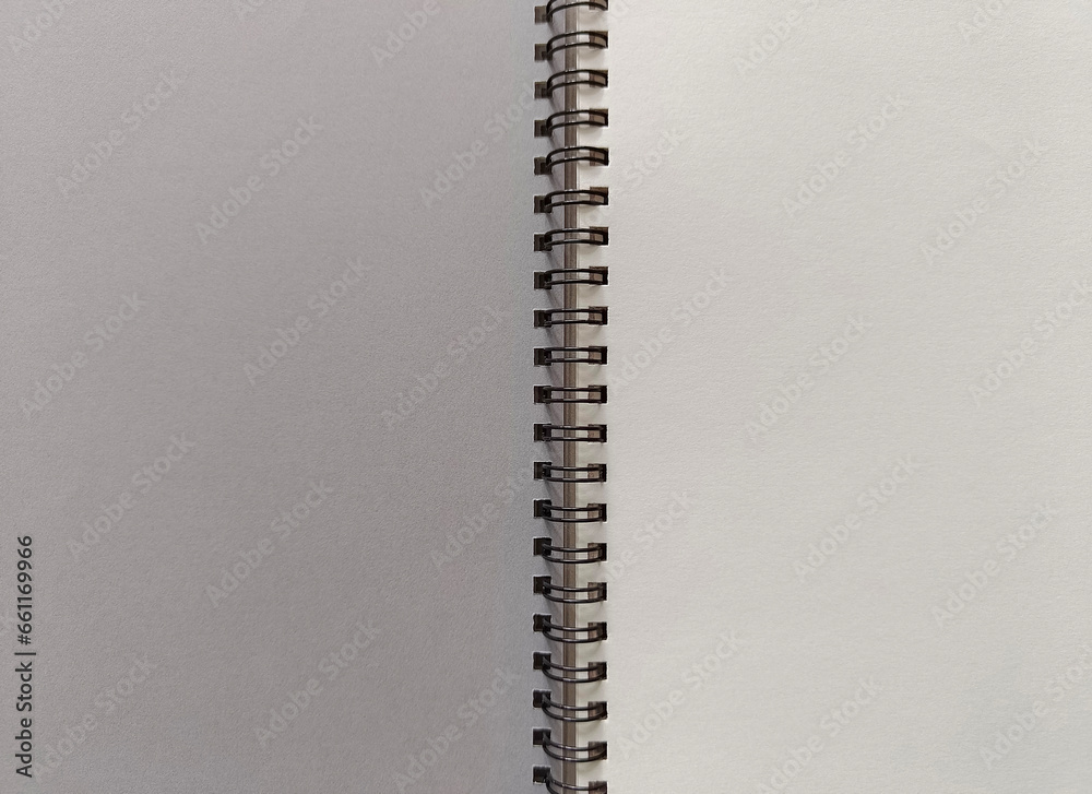 Open notebook on a spring. A clean white sheet, a place for writing. Open notebook on a spring. A clean white sheet, a place for writing.