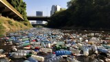 A riverbank littered with discarded plastic bottles and waste.