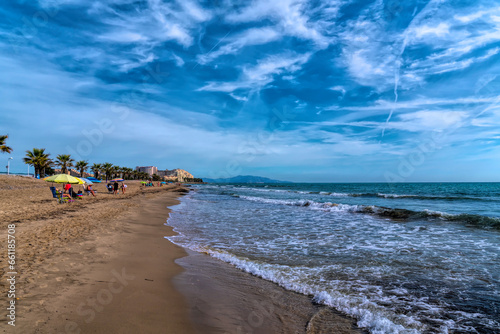 Oropesa del Mar beach of Playa Morro de Gos with Mediterranean sea and waves Costa del Azahar, Spain between Benicassim and Marina D`or