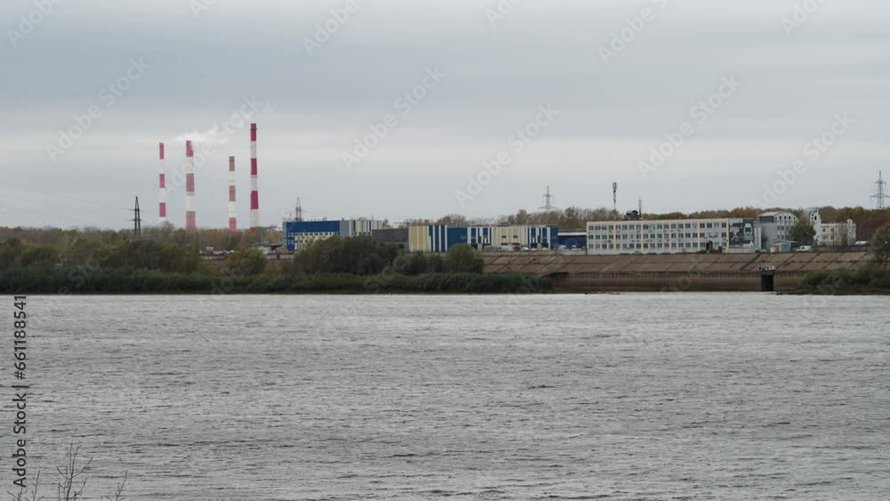Urban infrastructure on the banks of the river. The industrial zone of the city on the banks of the river Urban infrastructure on the banks of the river. The industrial zone of the city on the banks of the river