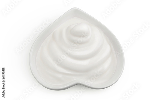 sour cream or yogurt in red ceramic bowl heart shaped isolated on white background with full depth of field. Top view. Flat lay