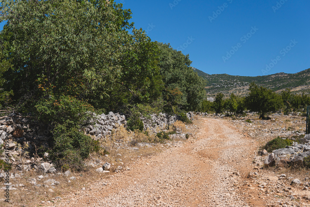 ground road through a hilly terrain in Croatia