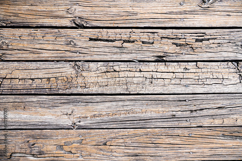 Texture of an old wooden board with nails. Space for text.