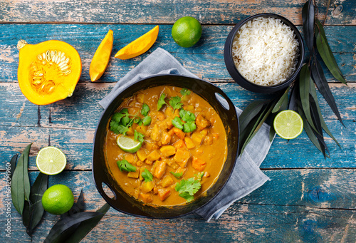 Obraz na plátně Traditional Indian vegetarian curry stew with sweet potatoes, pumpkin and rice s