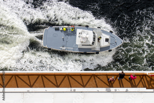 pilot boat pulling alongside cruse ship from above