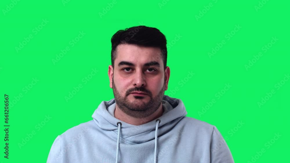 A Young Attractive Man Participates in a Video Conference on Green Screen A Young Attractive Man Participates in a Video Conference on Green Screen