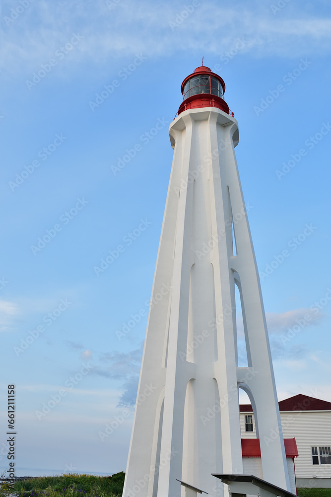 Pointe au pere, father point lighthouse. National historic site. Canada Park. White and red lighthouse with unique structure. Rimouski, Quebec, Canada. Second highest lighthouse in Canada. Pointe au pere, father point lighthouse. National historic site. Canada Park. White and red lighthouse with unique structure. Rimouski, Quebec, Canada. Second highest lighthouse in Canada.