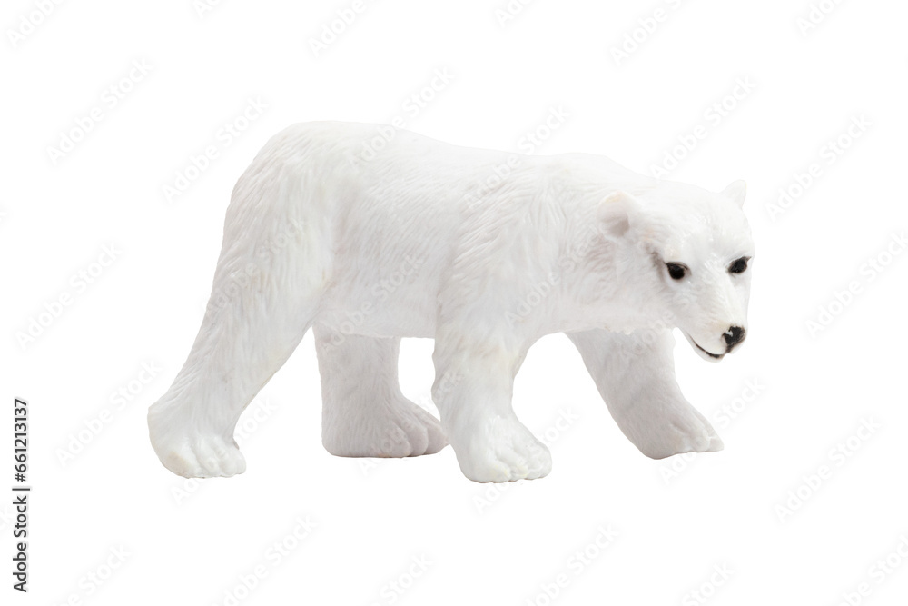 An isolated toy polar bear walking on all fours in profile. Wild animals concept. An isolated toy polar bear walking on all fours in profile. Wild animals concept.