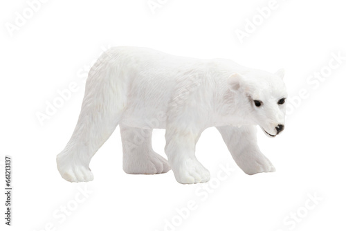 An isolated toy polar bear walking on all fours in profile. Wild animals concept.