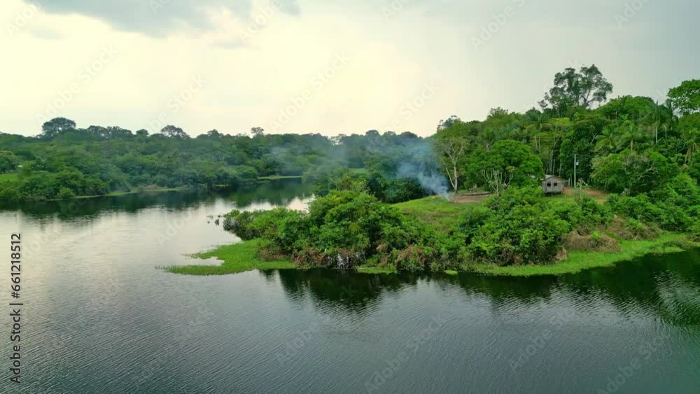 Isolated house in the jungle of amazon tropical rainforest river Isolated house in the jungle of amazon tropical rainforest river