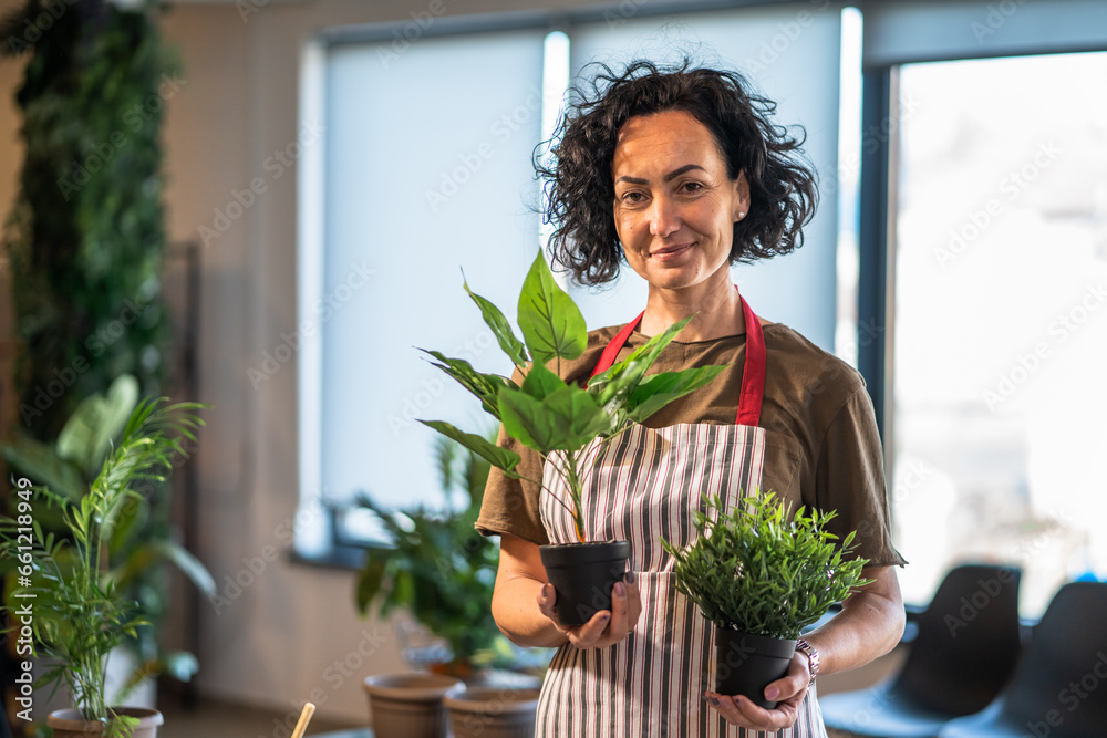 portrait of woman mature caucasian female take care of plants at home portrait of woman mature caucasian female take care of plants at home