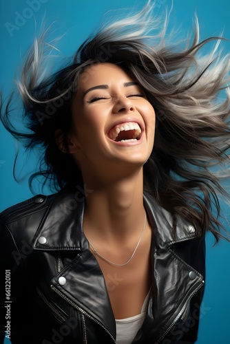 A portrait of a woman laughing.