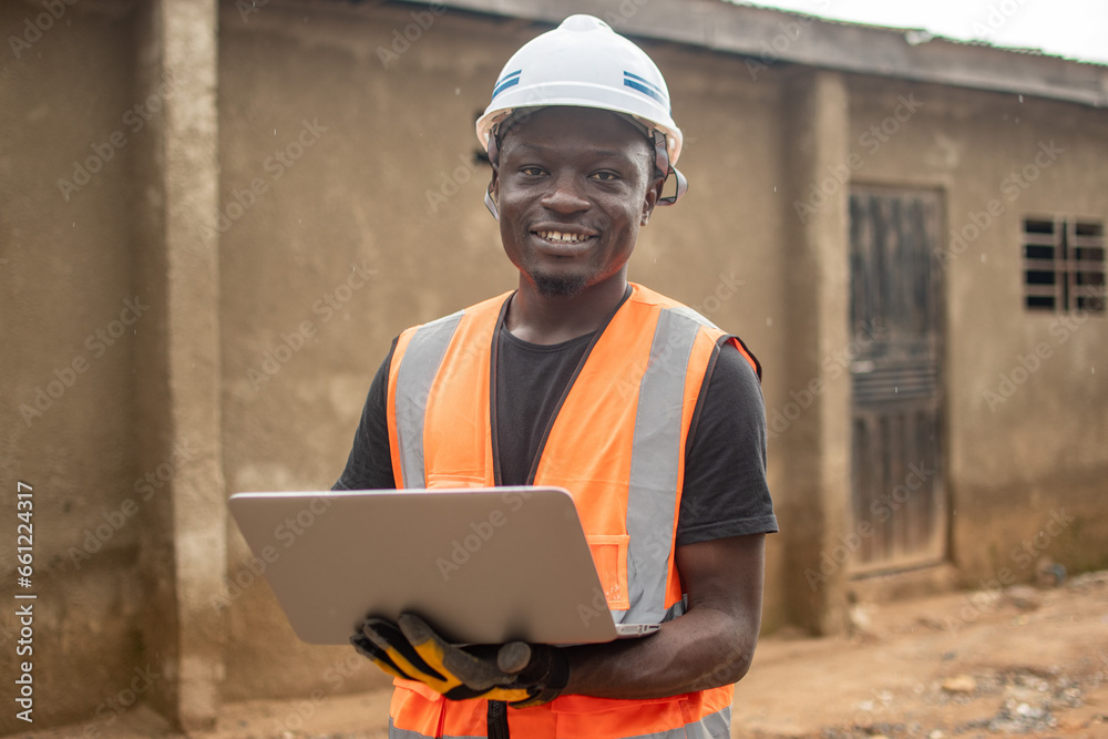 Fototapeta premium african engineer using his laptop computer