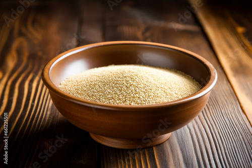 sesame seeds in a bowl on a wooden table. 