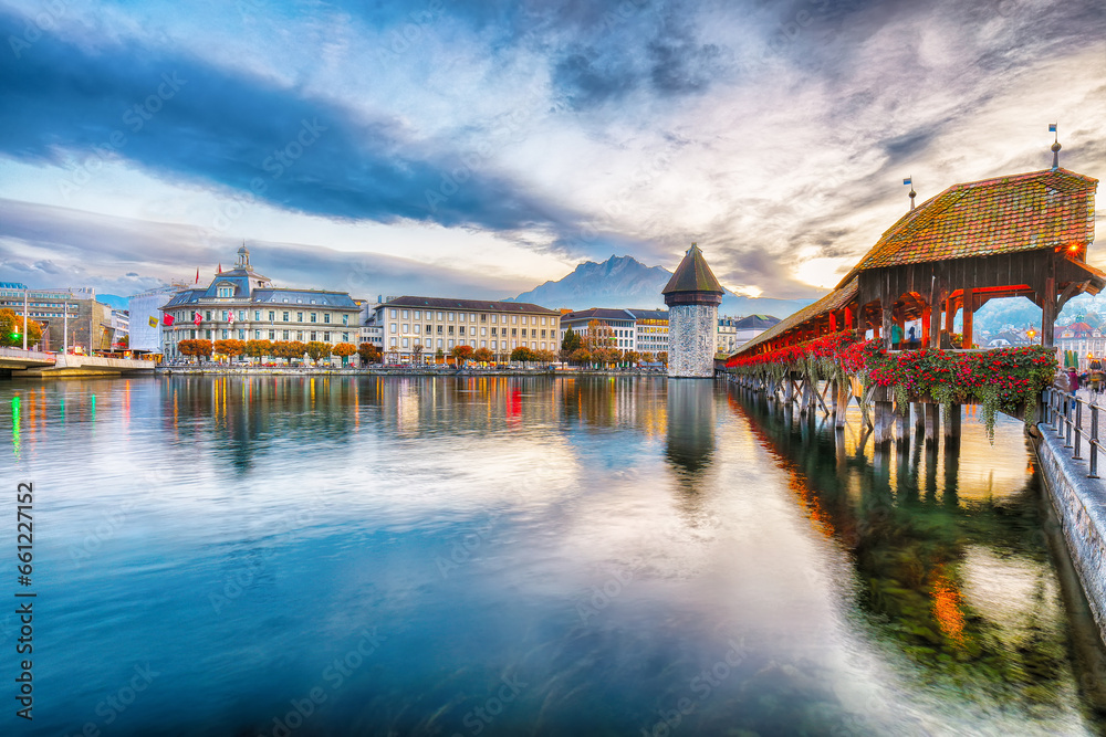 Breathtaking historic city center of Lucerne with famous buildings and old wooden Chapel Bridge (Kapellbrucke)