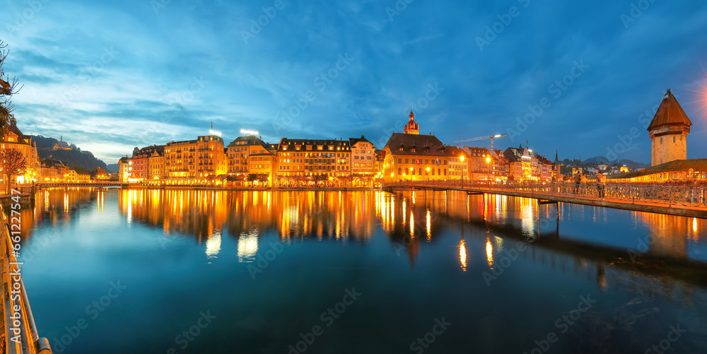 Obraz premium Beautiful historic city center of Lucerne with famous buildings and promanade during night..