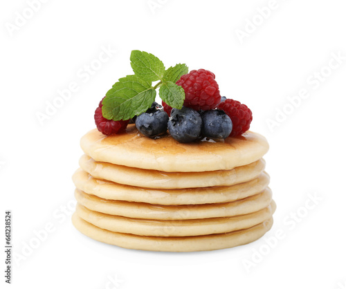 Delicious pancakes with berries, honey and mint isolated on white