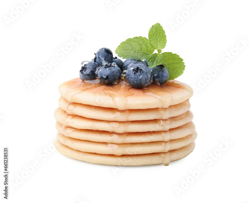 Delicious pancakes with blueberries, mint and honey isolated on white