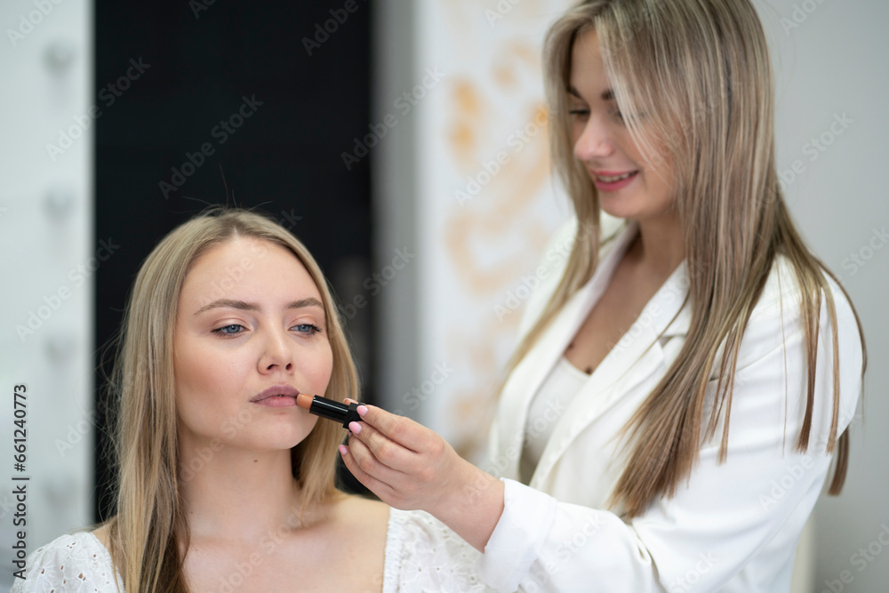 make-up salon, doing some procedures to a female face make-up salon, doing some procedures to a female face