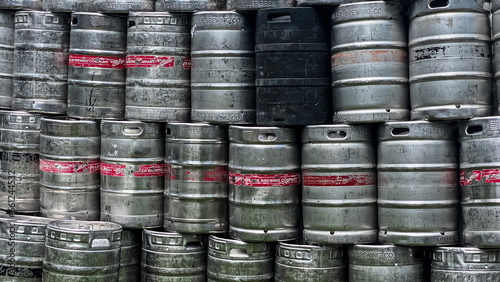 Empty Beer Kegs Stacked up Against Bar Wall