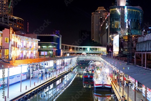 Bangkok  Thailand - December 31  2019   Pratunam floating night market with its restaurants and boats at night in Bangkok