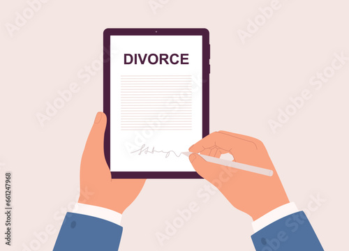 Male’s Hand Holding Tablet While Signing An Online Divorce Decree With Stylus Pen. Close-Up.
