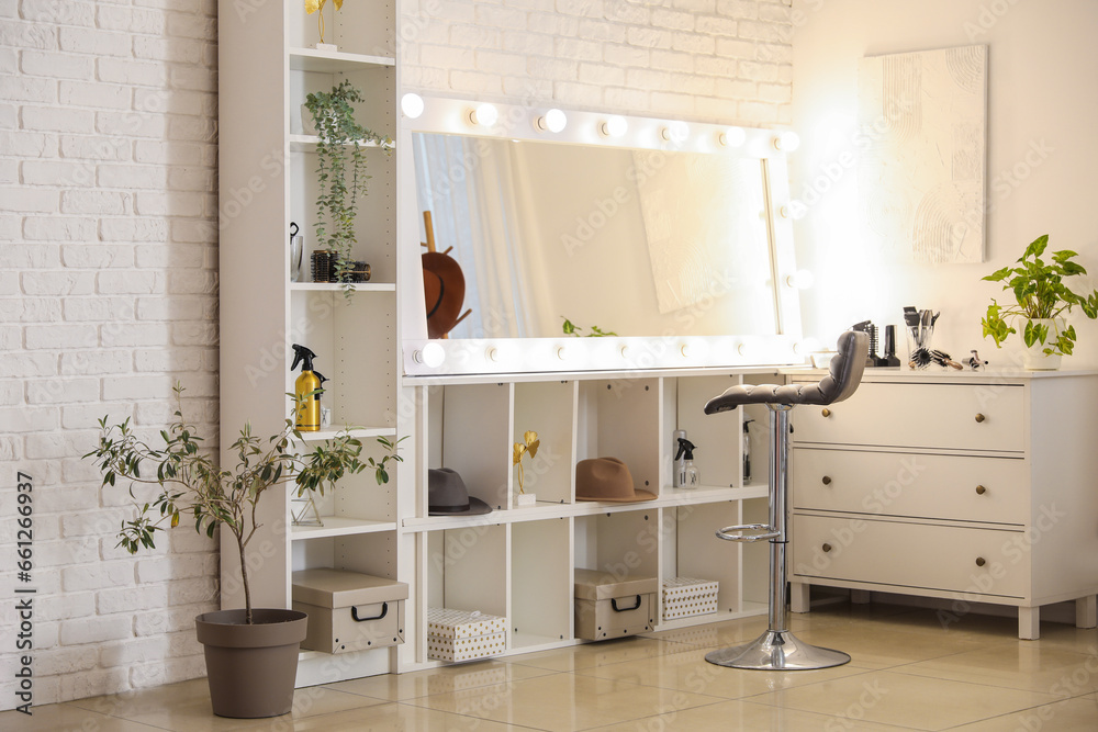 Interior of beauty salon with mirror and chest of drawers Interior of beauty salon with mirror and chest of drawers