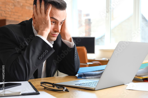Stressed businessman workin...