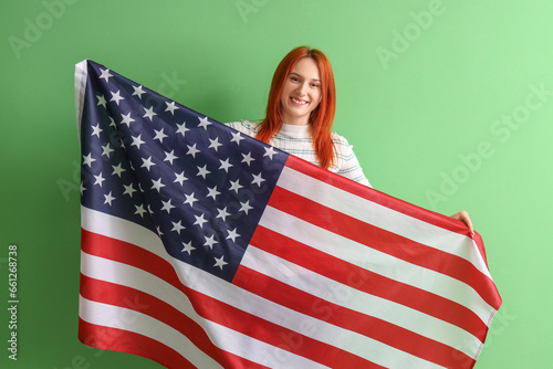 Young redhead woman with US...