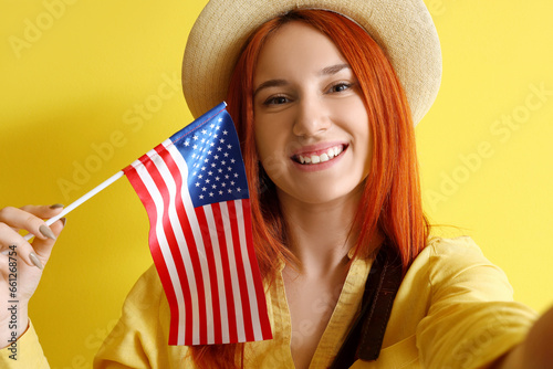Young redhead woman with US...