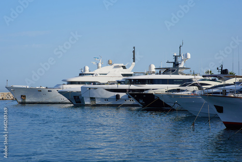 Luxury yacht marina. Vacations And Tourism Concept, Beautiful white modern yachts at sea port. © Евгений Бордовский