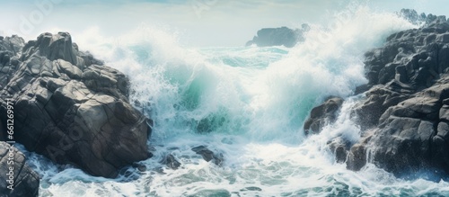 Waves forcefully hitting rocks