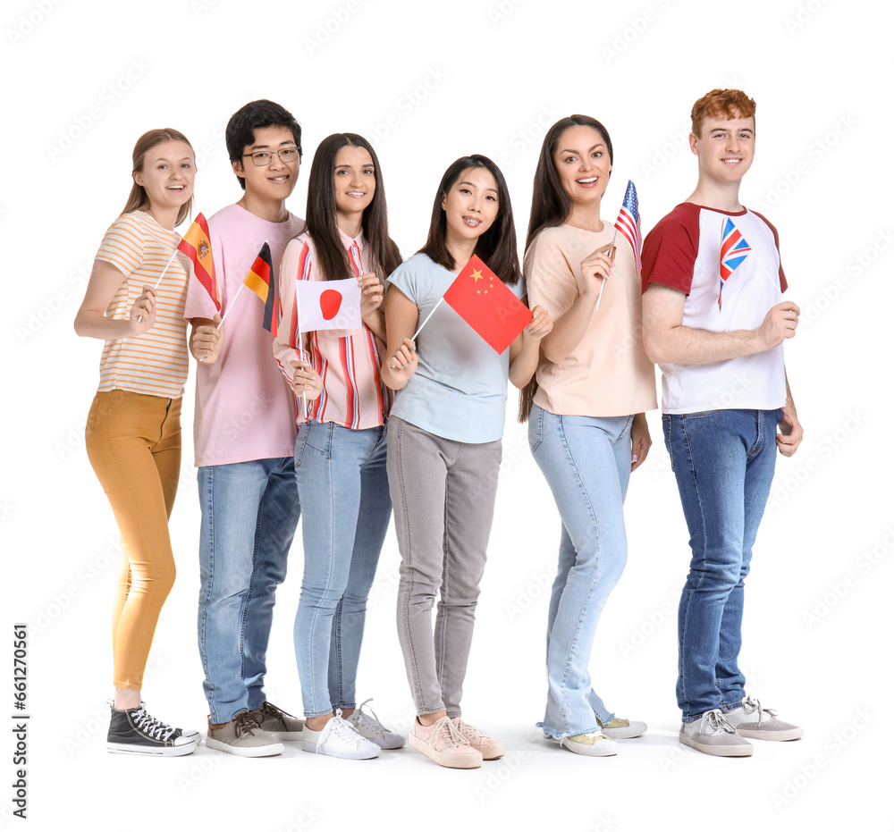 Young students of language school with flags on white background
