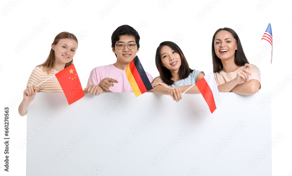 Young students of language school with flags and blank poster on white background Young students of language school with flags and blank poster on white background