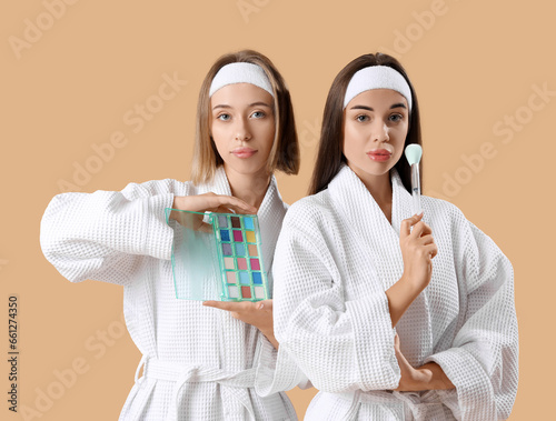 Young women in bathrobes, w...