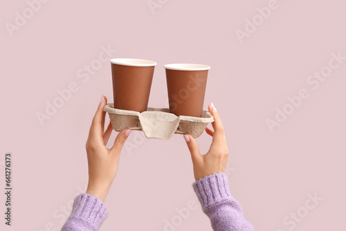 Female hands holding two di...