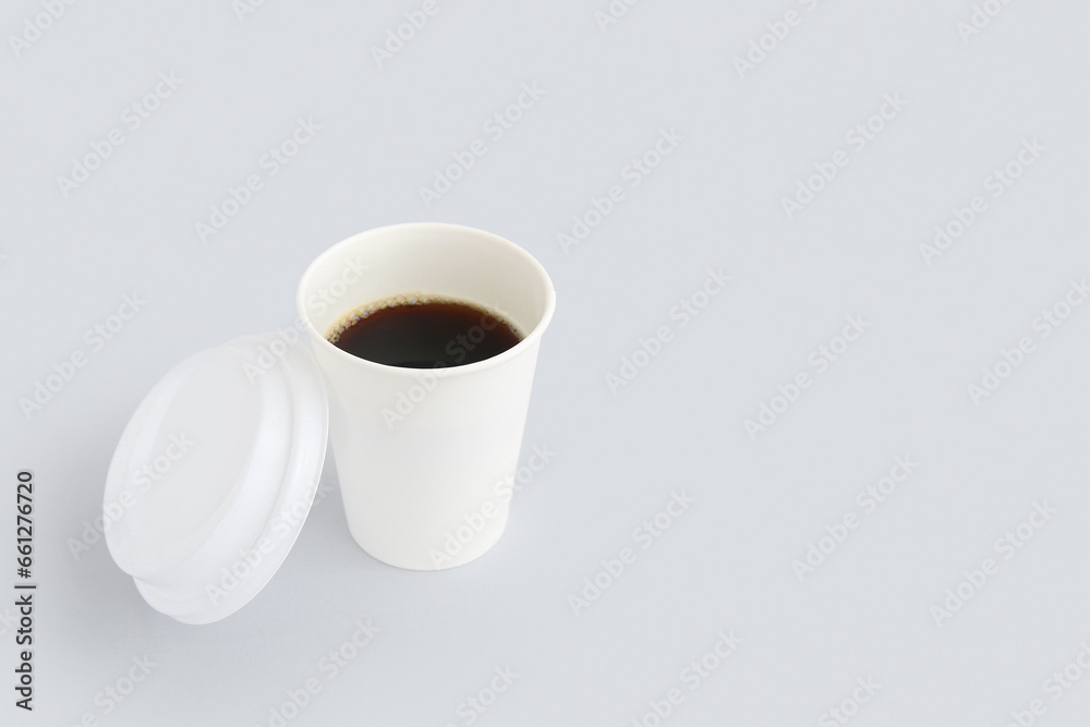 Takeaway paper cup of tasty coffee on white background Takeaway paper cup of tasty coffee on white background