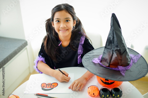 Wallpaper Mural Halloween, holiday and childhood concept. Little kids southeast asian on halloween dressed in a witch costume. Torontodigital.ca