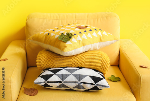 Cozy yellow armchair with s...