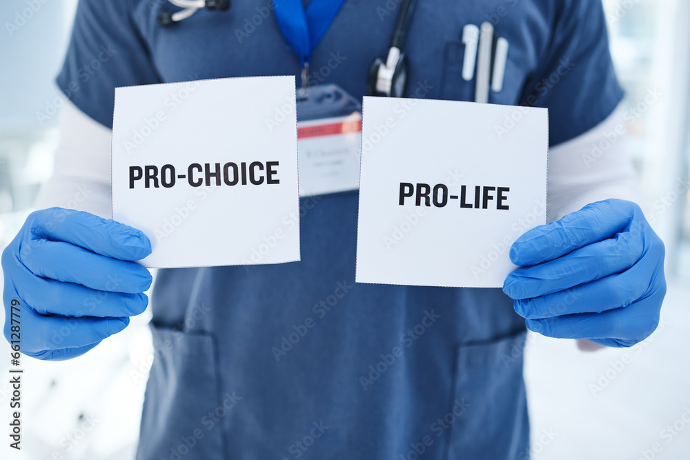 Life, choice and doctor with paper in hands for abortion, human rights or decision in clinic. Nurse, poster and vote for women with option for family planning in hospital or medical contraception Life, choice and doctor with paper in hands for abortion, human rights or decision in clinic. Nurse, poster and vote for women with option for family planning in hospital or medical contraception