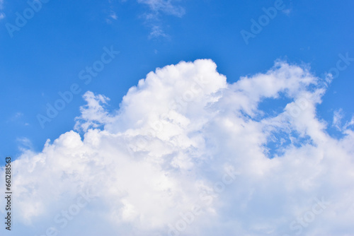 beautiful blue sky and white fluffy group of clouds with sunrise in the morning, natural background