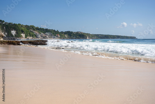 beach with rocky mountains and clear water of Indian ocean at sunny day . 