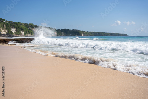 beach with rocky mountains and clear water of Indian ocean at sunny day . 