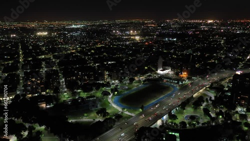 Wallpaper Mural Moving aerial shot at night of the city of Buenos Aires with buildings and street with traffic Torontodigital.ca