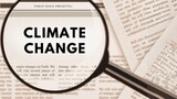 Selective Focus Photography of Climate Change Text Publication in Newspaper