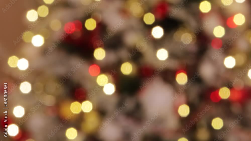 Christmas lights bokeh, selective focus, blurred background, smooth focus movement, Christmas lights. Christmas lights bokeh, selective focus, blurred background, smooth focus movement, Christmas lights.