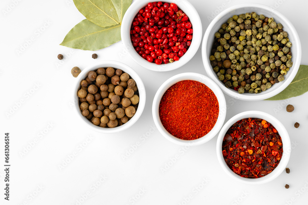 Various spices in a bowls on white background Various spices in a bowls on white background