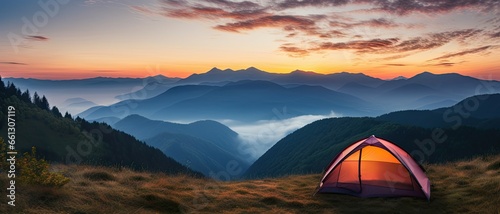 Tent amidst majestic mountains at sunset. Sunrise camping. Embracing nature beauty in mountain. Outdoor adventures. Summer under starry sky © Thares2020