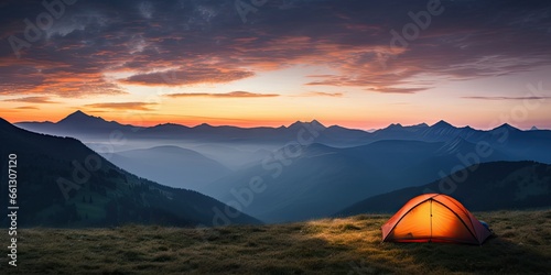 Tent amidst majestic mountains at sunset. Sunrise camping. Embracing nature beauty in mountain. Outdoor adventures. Summer under starry sky © Thares2020